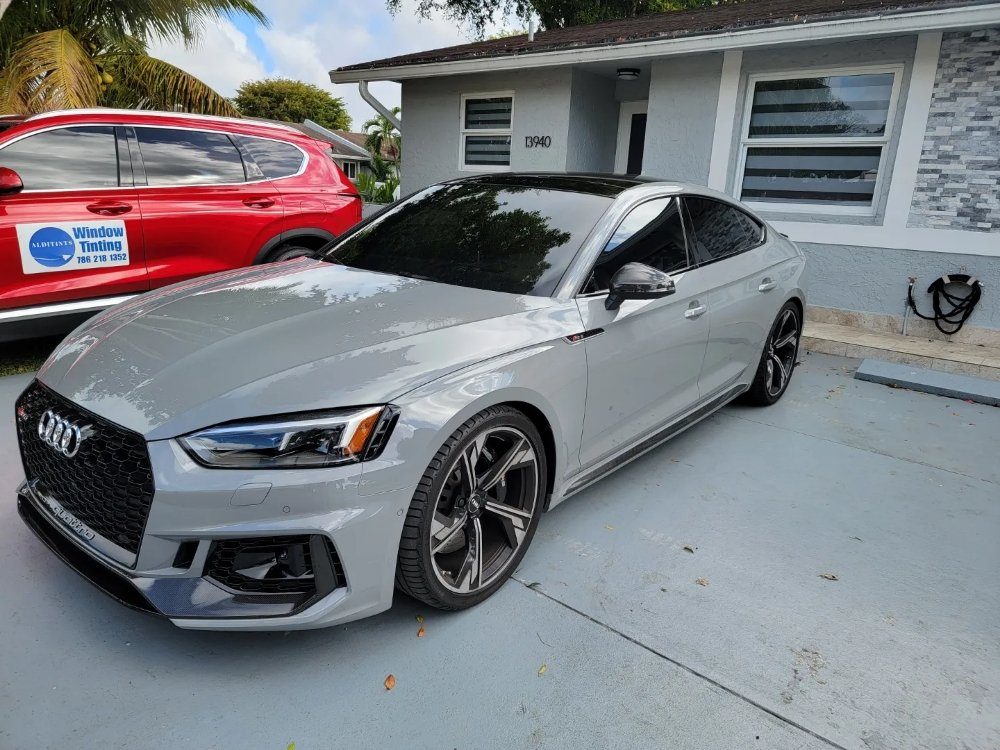 Silver Audi RS5 with fresh window tint outside Alditints in Hialeah