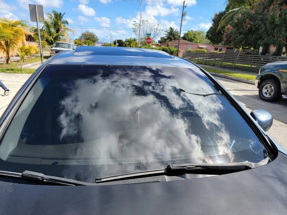 Tinted windshield strip on a sedan