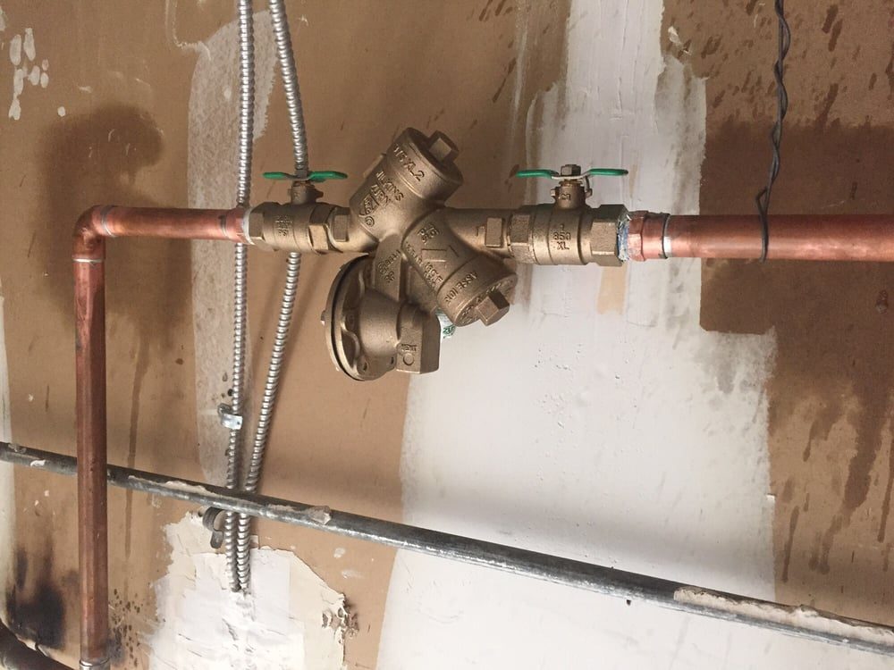 Backflow preventer valve on a copper line