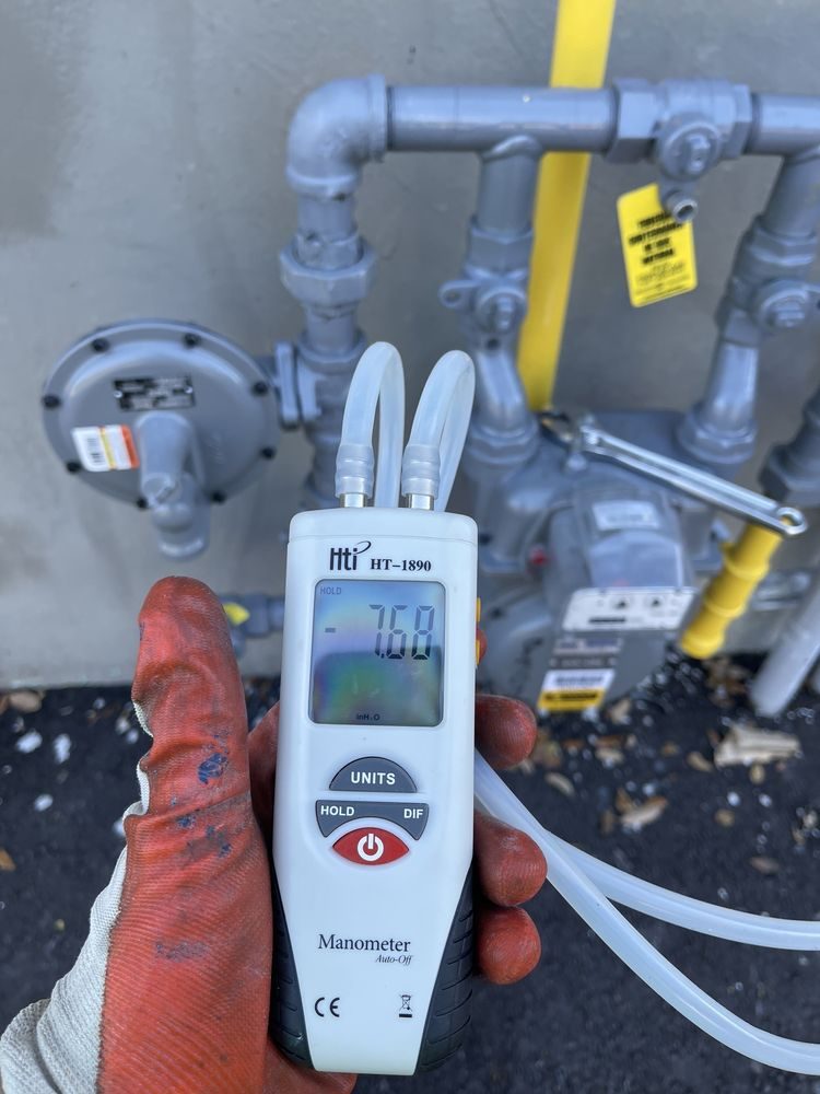 Digital manometer pressure test on a gas meter
