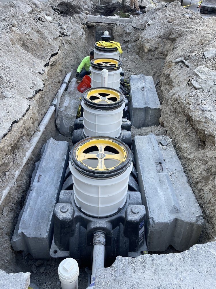 Sewer lift station pumps being set in an excavation