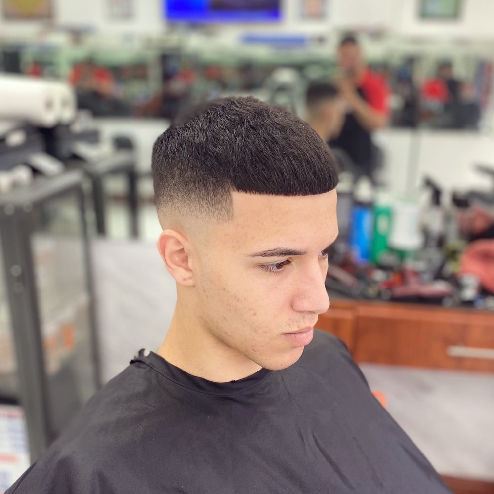 Clean skin fade with a hard part