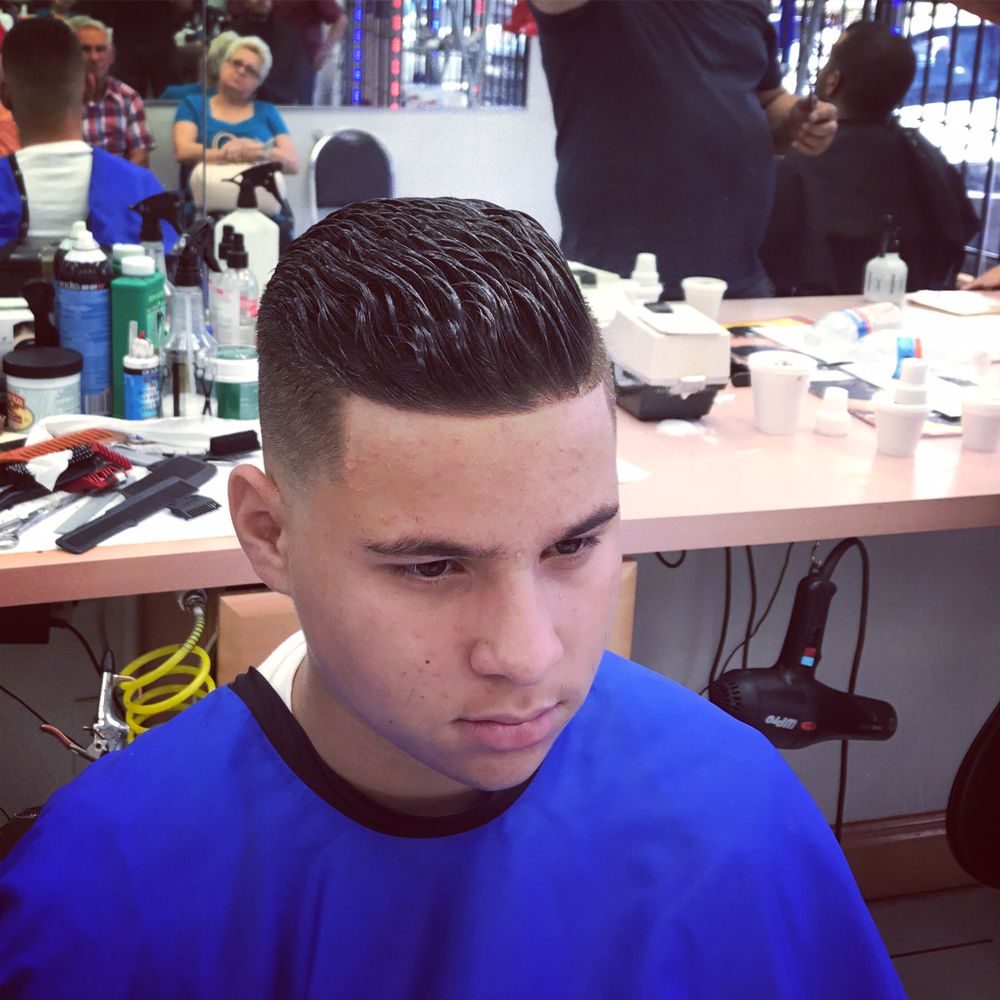 Kids fade in the chair at Flores Brothers