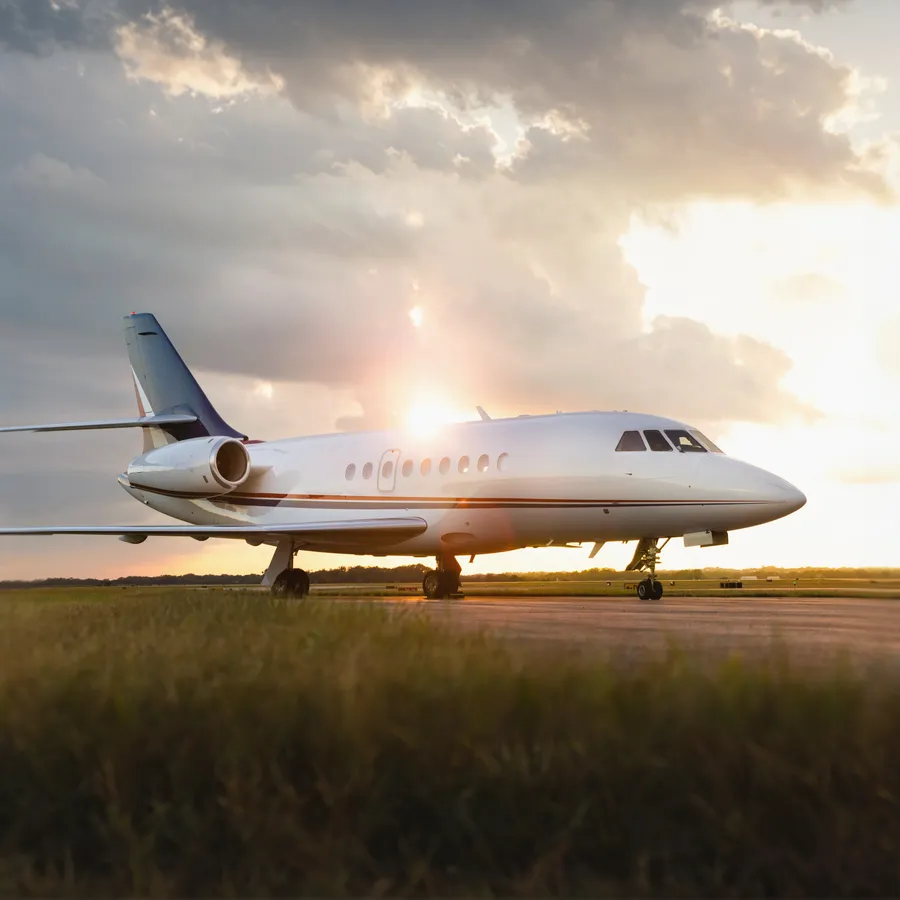 Falcon jet at sunset