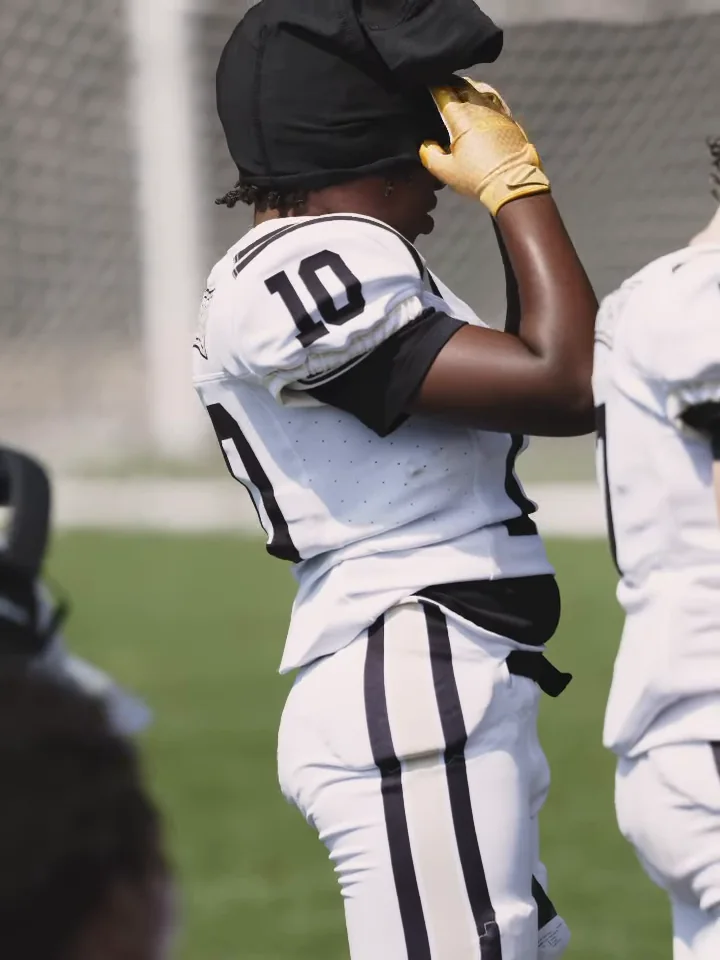 Chase pulling on his helmet before the game