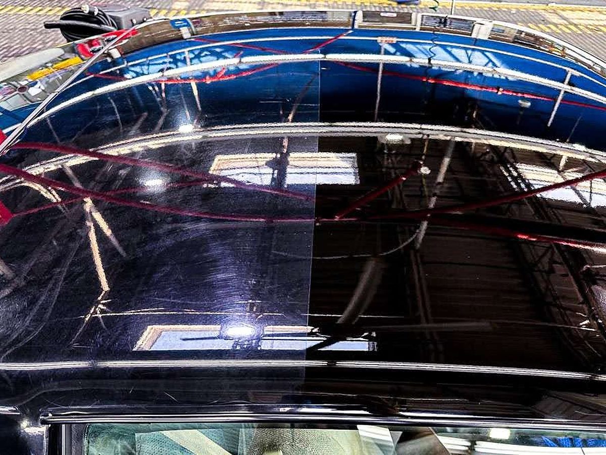 Wet-look gloss on a black roof after polish and sealant, the same compounding and UV seal we use on gelcoat hulls