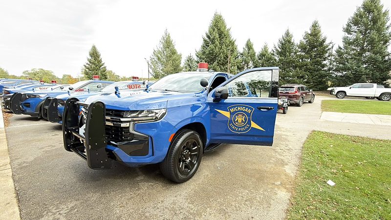 Michigan State Police Chevy Tahoe fleet lined up in a lot after fleet detailing