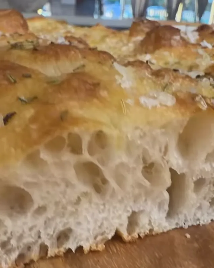 Rosemary focaccia cut open to show its airy crumb