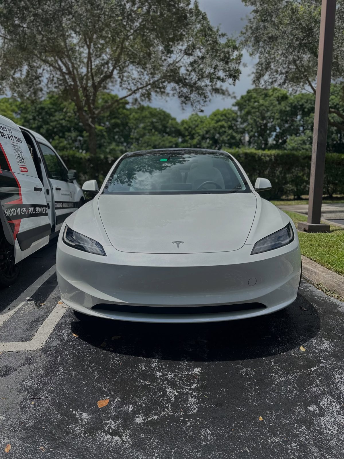 White Tesla Model 3 freshly washed