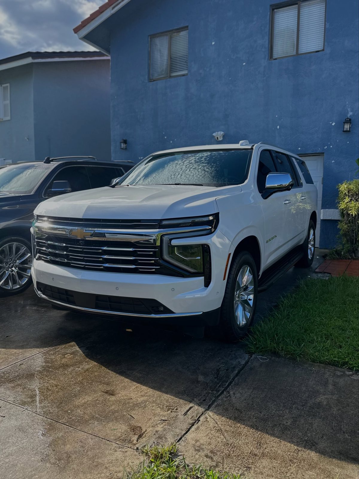 White Chevy Tahoe washed in front of a Kendall home