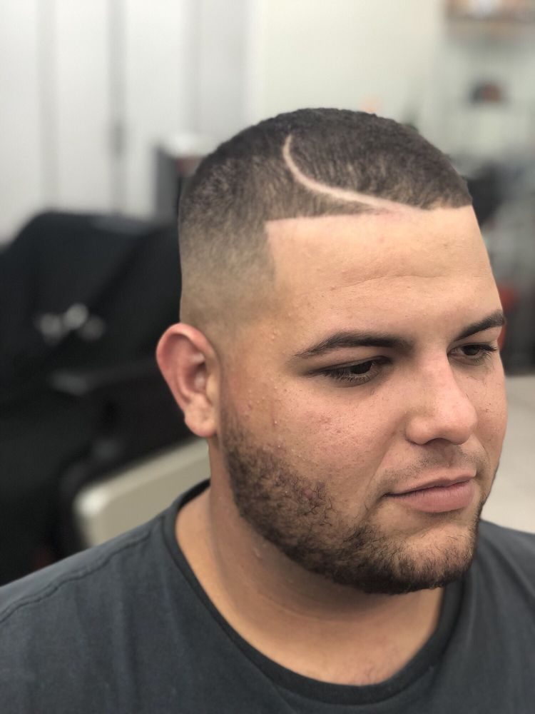 Skin fade with a sharp hard part