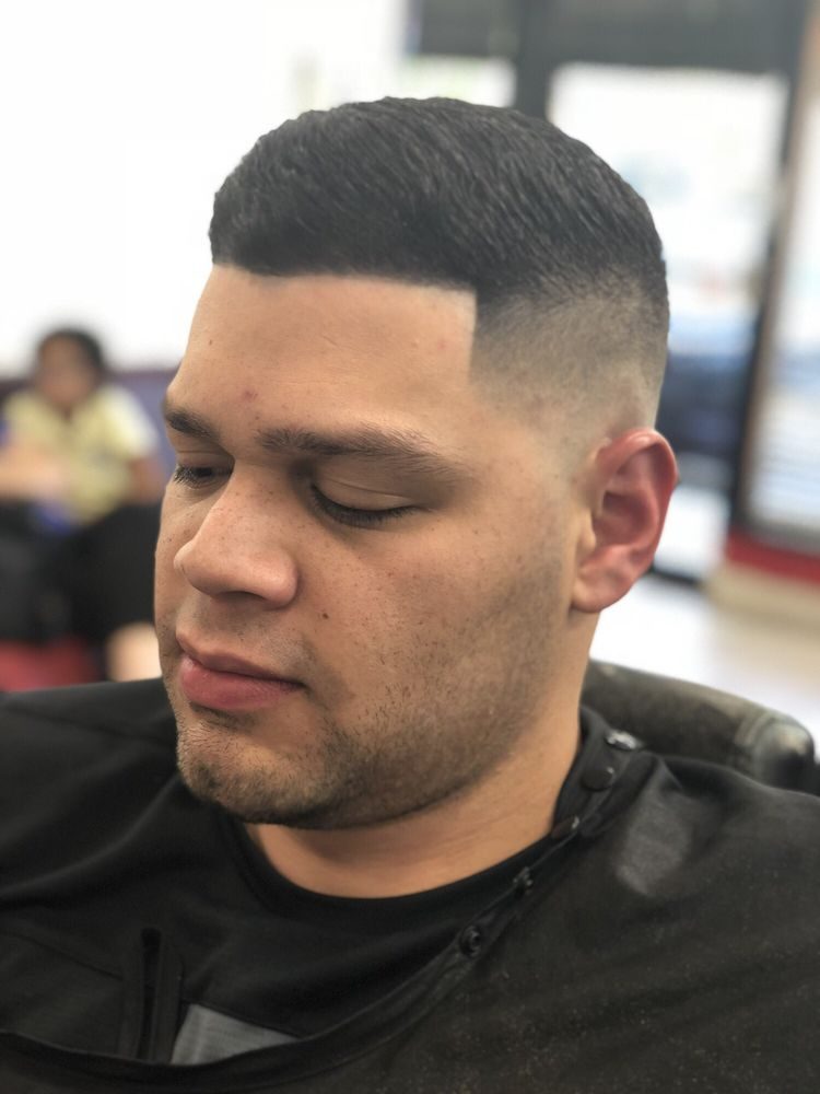 Clean fade with a hard part