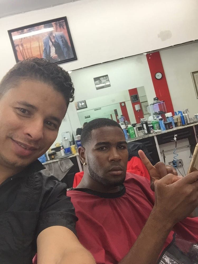 Barber and client at the chair