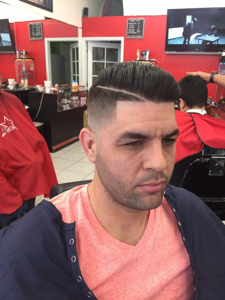 Fresh fade with a hard part at Maikel Barber Star, Miami
