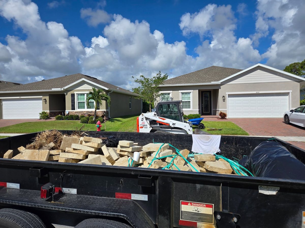 Dump trailer loaded with clean fill dirt on a driveway