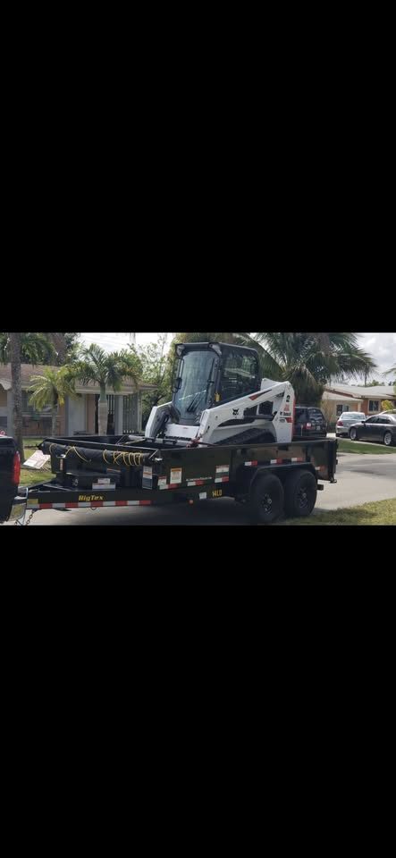 RWP's Bobcat loaded on the Big Tex dump trailer behind the F-250