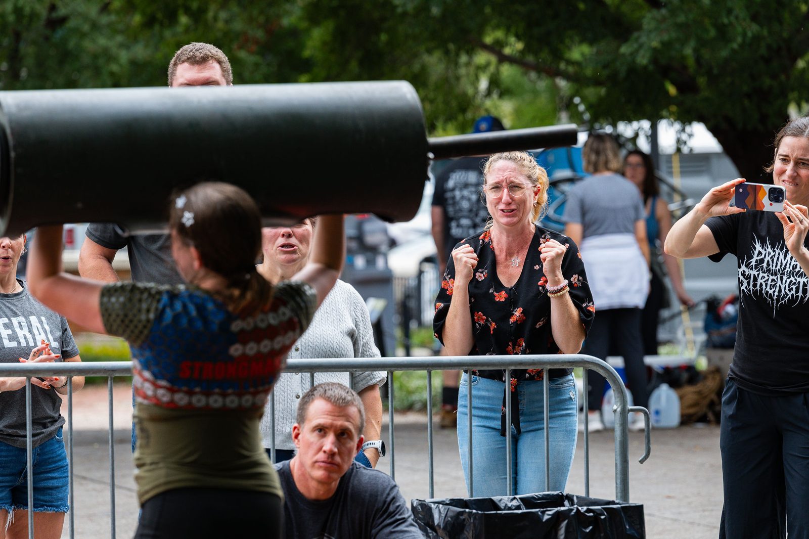 Athletes lifting a log while the crowd cheers at Star City Strongman