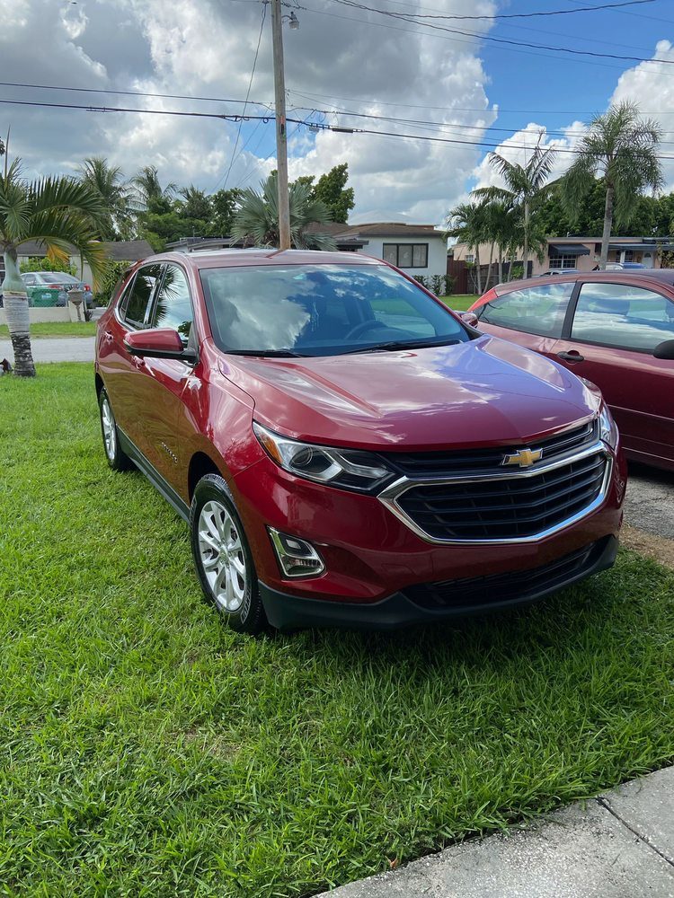 Red Chevy Equinox after a wash and wax