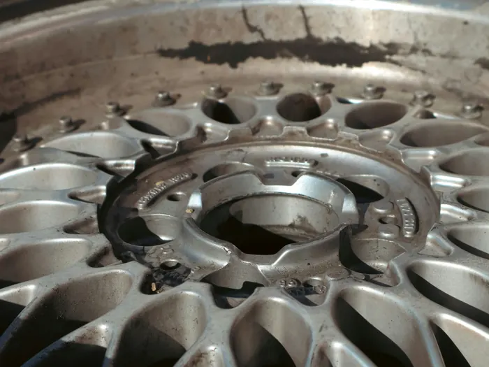 Example before photo: a silver mesh wheel with grime streaks and a dull, dirty finish