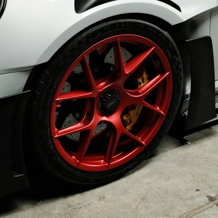 Red wheel on a white sports car