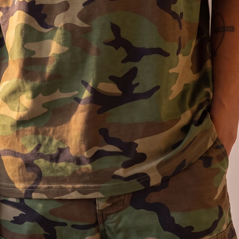 Woodland camo, the tee hem over the cargo trousers