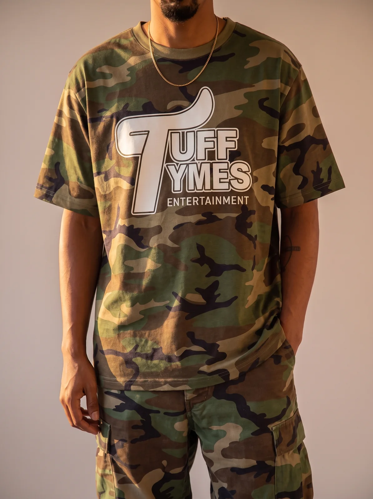 The TUFF TYMES Entertainment print on the woodland camo tee