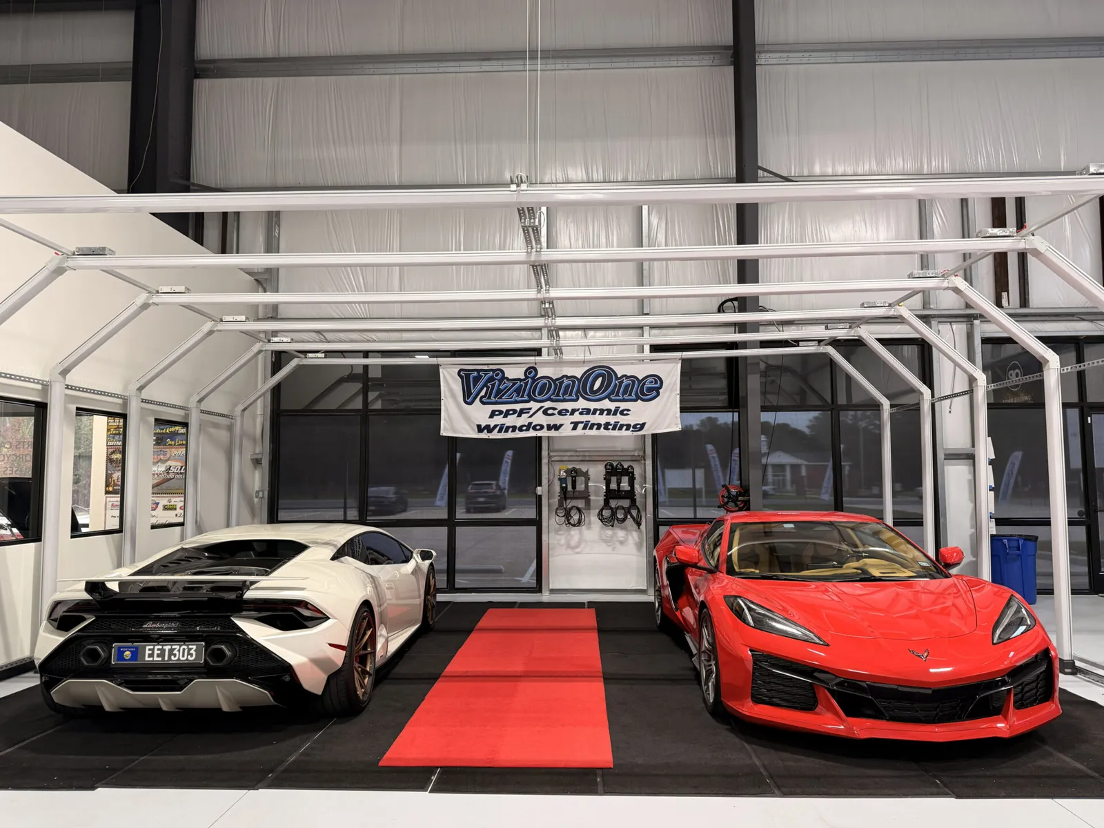 Lamborghini Huracán and Corvette under the light tunnel